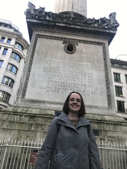 The Author in front of the base of the Monument to the Great Fire of London
